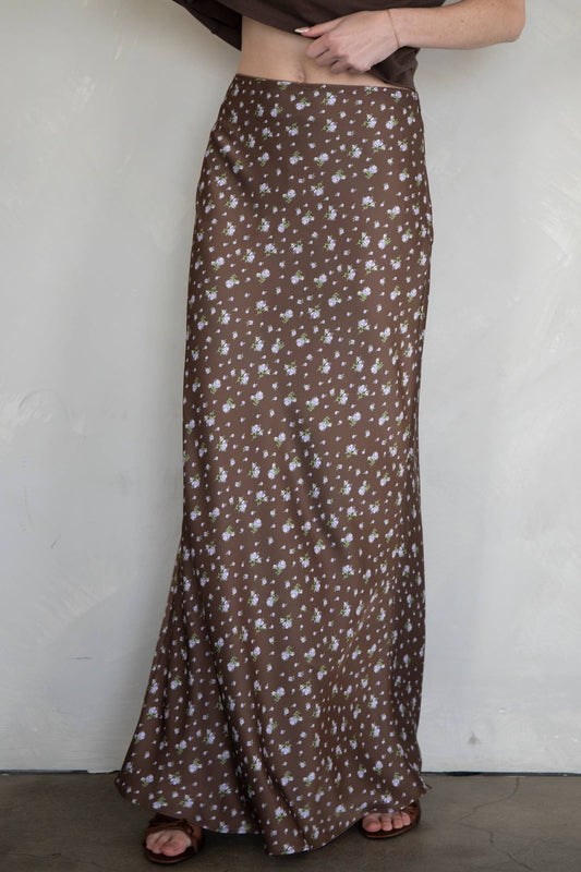 Brown floral patterned skirt worn by a person against a plain background available at Erin Rose Boutique