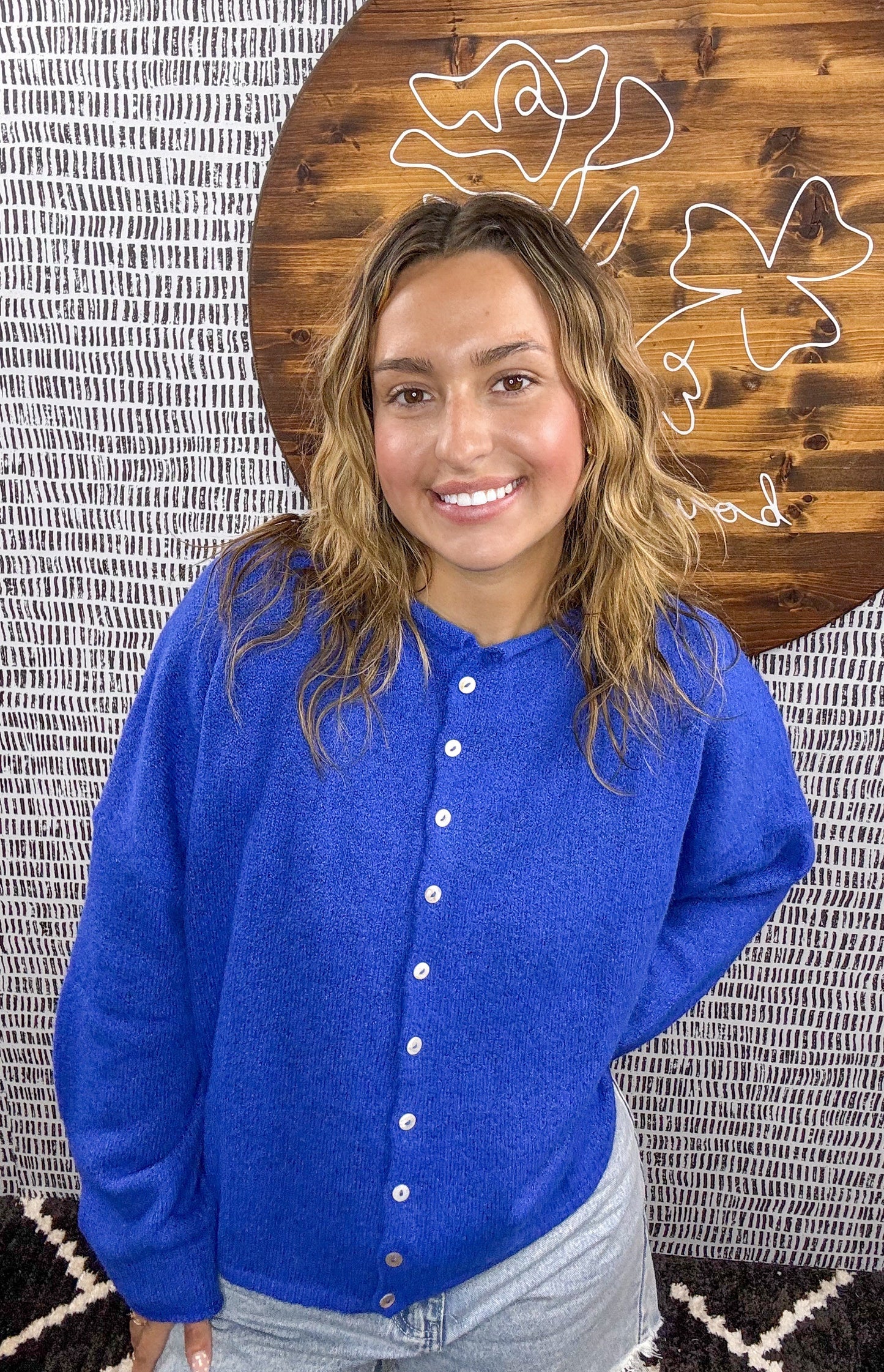 Model wearing cobalt blue button-down cardigan with relaxed fit, paired with light denim shorts – Erin Rose Boutique