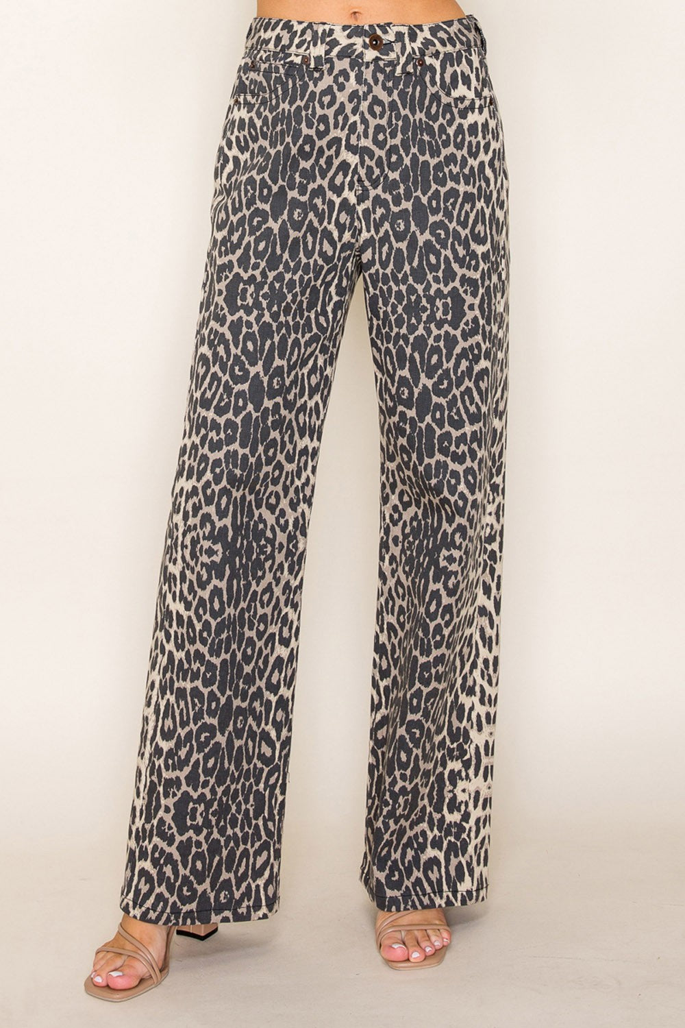 Front view of leopard print wide-leg jeans with button closure, bold animal print trousers for stylish women’s boutique fashion