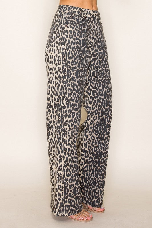 Side view of leopard print wide-leg jeans with relaxed fit, trendy animal print trousers for bold summer and fall fashion