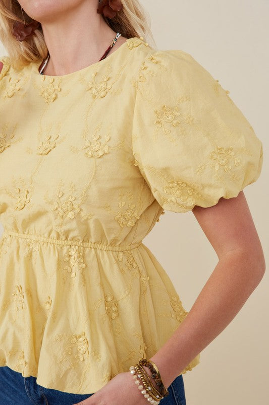 side view of Lydia crochet eyelet bubble peplum top with puff sleeves and bubble hem, Erin Rose Boutique