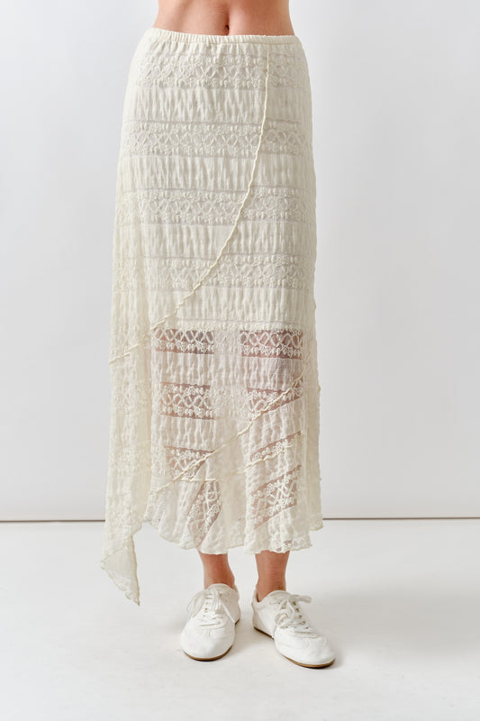 Person wearing a white lace skirt available at Erin Rose Boutique