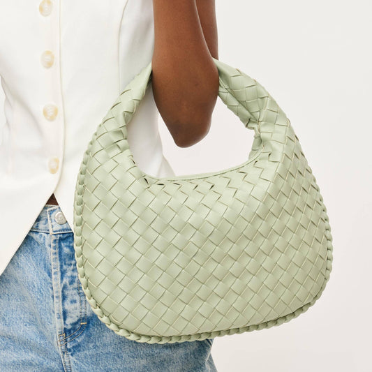 Sage green woven shoulder bag with braided detailing and slouchy silhouette, a chic accessory from Erin Rose Boutique