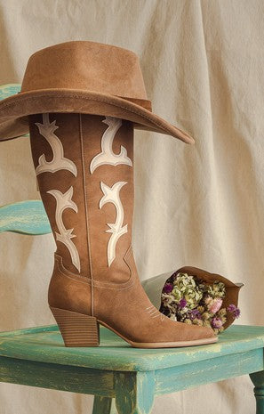 Adriana rodeo boots with cowgirl hat on top