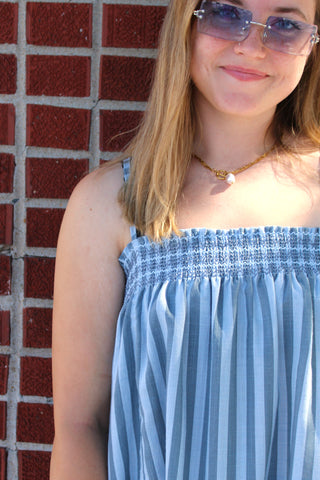 Close up of Blue Mason striped cami mini dress with smocked bodice