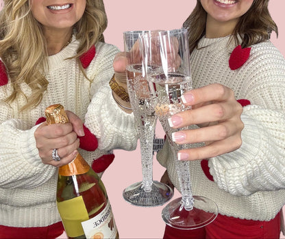 Cream chunky knit sweater with red heart appliqué details for women