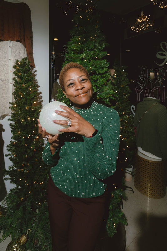 Festive pearl-studded knit sweater styled for holiday season available at Erin Rose Boutique.