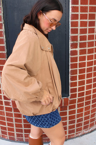 Ken camel jacket side view with funnel neck and zip front