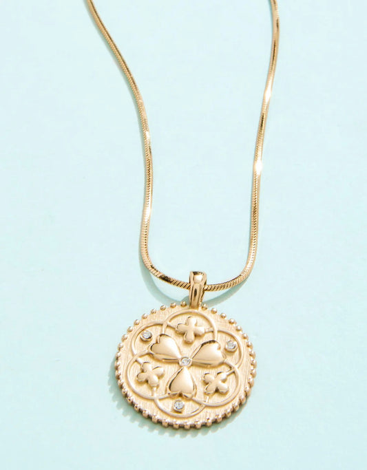 Gold clover medallion necklace with heart and crystal accents on gold chain – Erin Rose Boutique