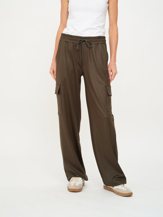 Front view of olive coated cargo pants with wide leg fit and subtle sheen