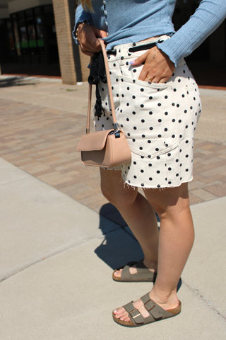 Side view of Melody cream denim shorts with black polka dots.