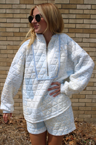 model wearing blue quilted patchwork pullover with half zip and relaxed fit styled as part of a matching set from Erin Rose Boutique