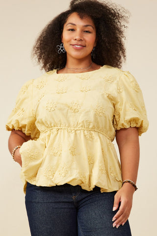 Plus-size model wearing Lydia crochet eyelet bubble peplum top with puff sleeves, bubble hem, and flattering fit