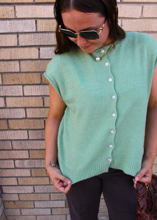 Casual matcha green sweater vest styled for fall