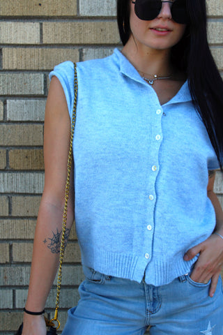 Woman wearing Abby Rose Piper sky blue button front knit vest cardigan available at Erin Rose Boutique