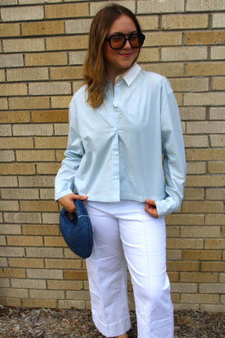 Woman wearing Alayna Striped Button Down featuring blue and white pinstripes, collared neckline, and relaxed fit.