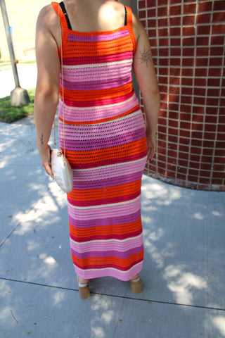 Women's striped crochet knit co-ord set with a sleeveless top and matching maxi skirt in bright summer hues.