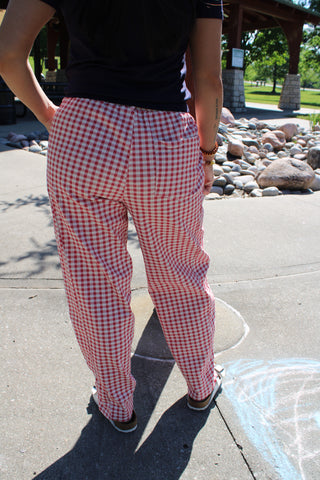 Back view of woman wearing Cherry Picnic Gingham Barrel Pants with a relaxed barrel-leg fit.