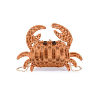 Beach-ready woven crab handbag with detailed wicker construction and playful seaside style.