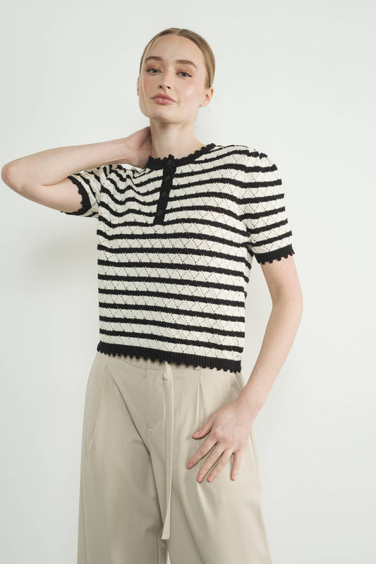 Woman wearing a black and white striped sweater available at Erin Rose Boutiqut