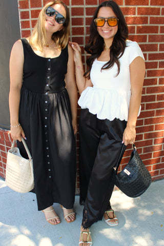 Chic black button front dress with a scoop neckline and lightweight flowy silhouette.