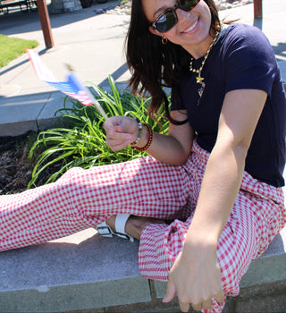Woman wearing Cherry Picnic Gingham Barrel Pants with a relaxed barrel-leg fit and a navy tee.