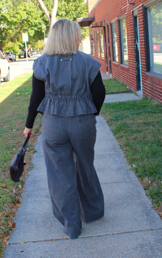 Back view of women's gray wide leg denim trousers