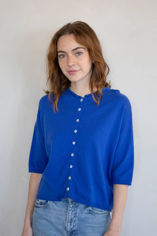Bright blue knit short sleeve top with front buttons and relaxed fit at Erin Rose Boutique