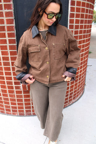 Brown utility jacket with black faux leather collar