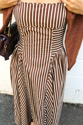 Front view of brown and cream vertical striped midi dress