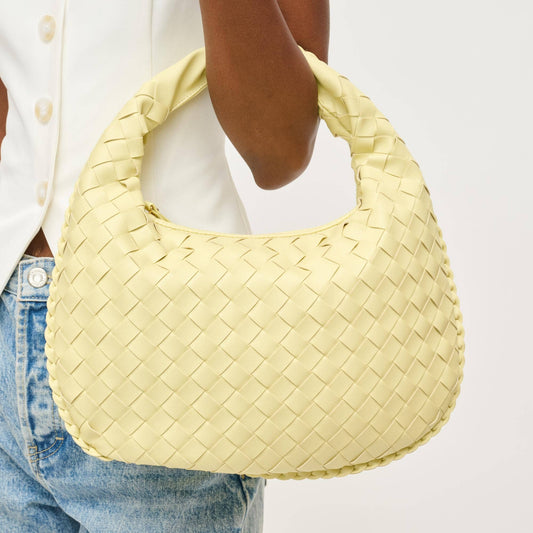 Butter yellow woven shoulder bag with braided texture and soft slouchy silhouette, styled for spring and summer — Erin Rose Boutique