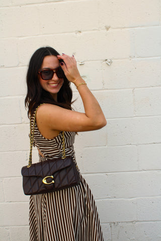 Chocolate brown striped midi dress styled for fall