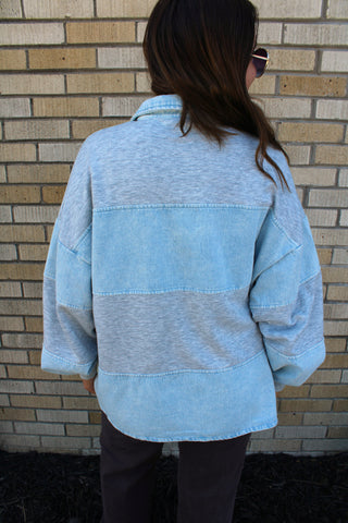 Oversized gray rugby sweatshirt with light wash denim back view.  Available at Erin Rose Boutique