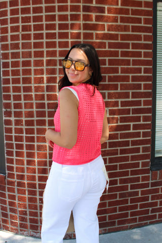 Trendy hot pink sleeveless knit top with an airy open-knit design and mock neckline.