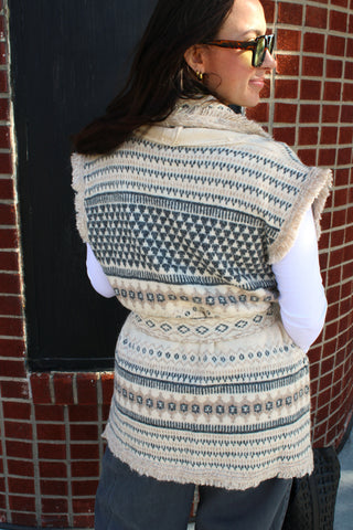 Cream knit sweater vest with adjustable tie waist