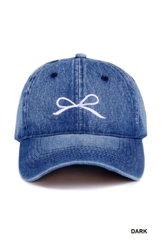 Blue denim cap with a white bow embroidered design available at Erin Rose Boutique