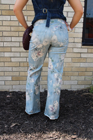 Back view of women's Dear John Micah floral wide leg jeans with high rise waist and vintage garden print
