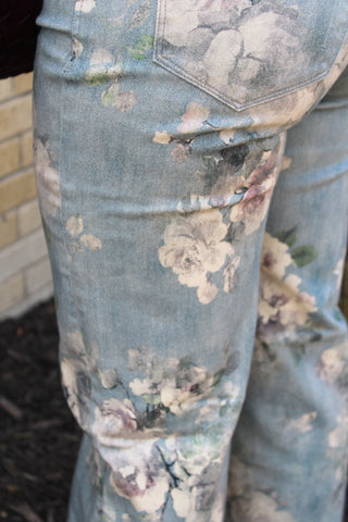 Close up of women's Dear John Micah floral wide leg jeans with high rise waist and vintage garden print 