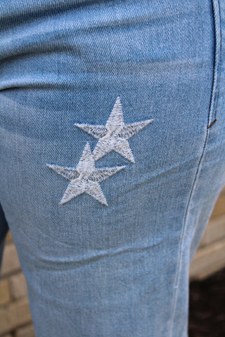Close up of white embroidered stars on Dear John Taylor jeans