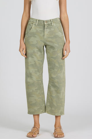 Person wearing green camouflage barrel stretch crop pants on a white background