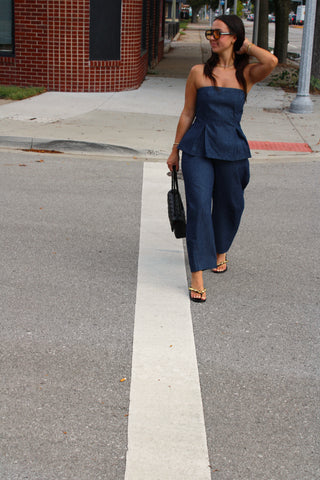 Women wearing the Rowan strapless denim pinstriped top styled with matching pants. Available at Erin Rose Boutique