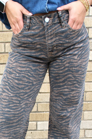 Women's statement denim featuring an allover tiger print pattern.