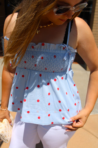 Dottie Dream blue and red polka dot smocked cami top styled with white denim