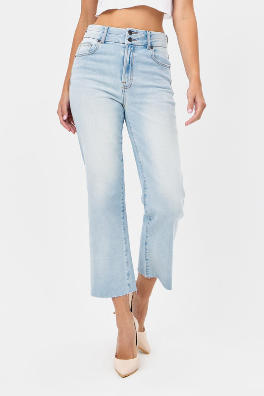 A pair of light blue denim wide leg jeans with a high waist and hidden waistband design.