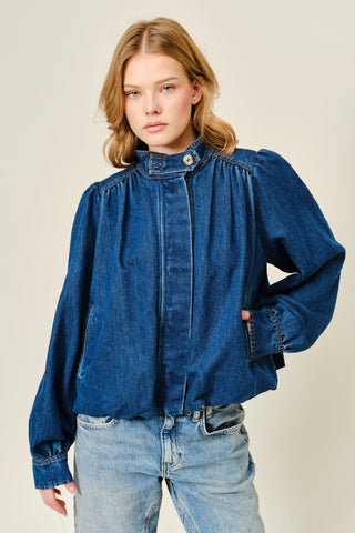 model wearing elevated denim bubble jacket with high neck, gathered shoulders, and relaxed fit from Erin Rose Boutique