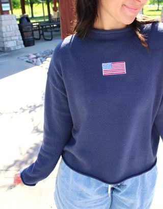 Lightweight navy sweater with classic flag detail.