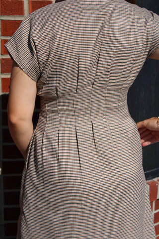 Back view of Emily houndstooth midi dress showing tailored waist and pleated detailing