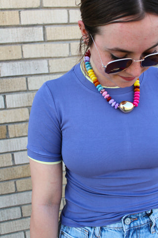 Women’s fitted short sleeve tee in periwinkle with butter yellow contrast trim casual outfit