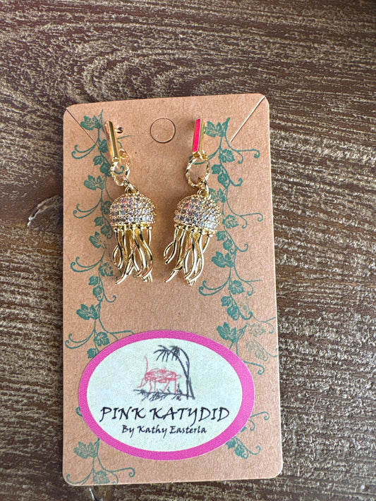 Gold jellyfish-shaped dangle earrings with crystal-studded tops and flowing fringe tentacles, handmade by Pink Katydid available at Erin Rose boutique