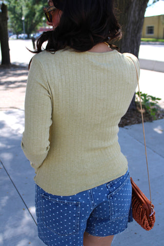 Soft green fig back view of ribbed knit cardigan with long sleeves.